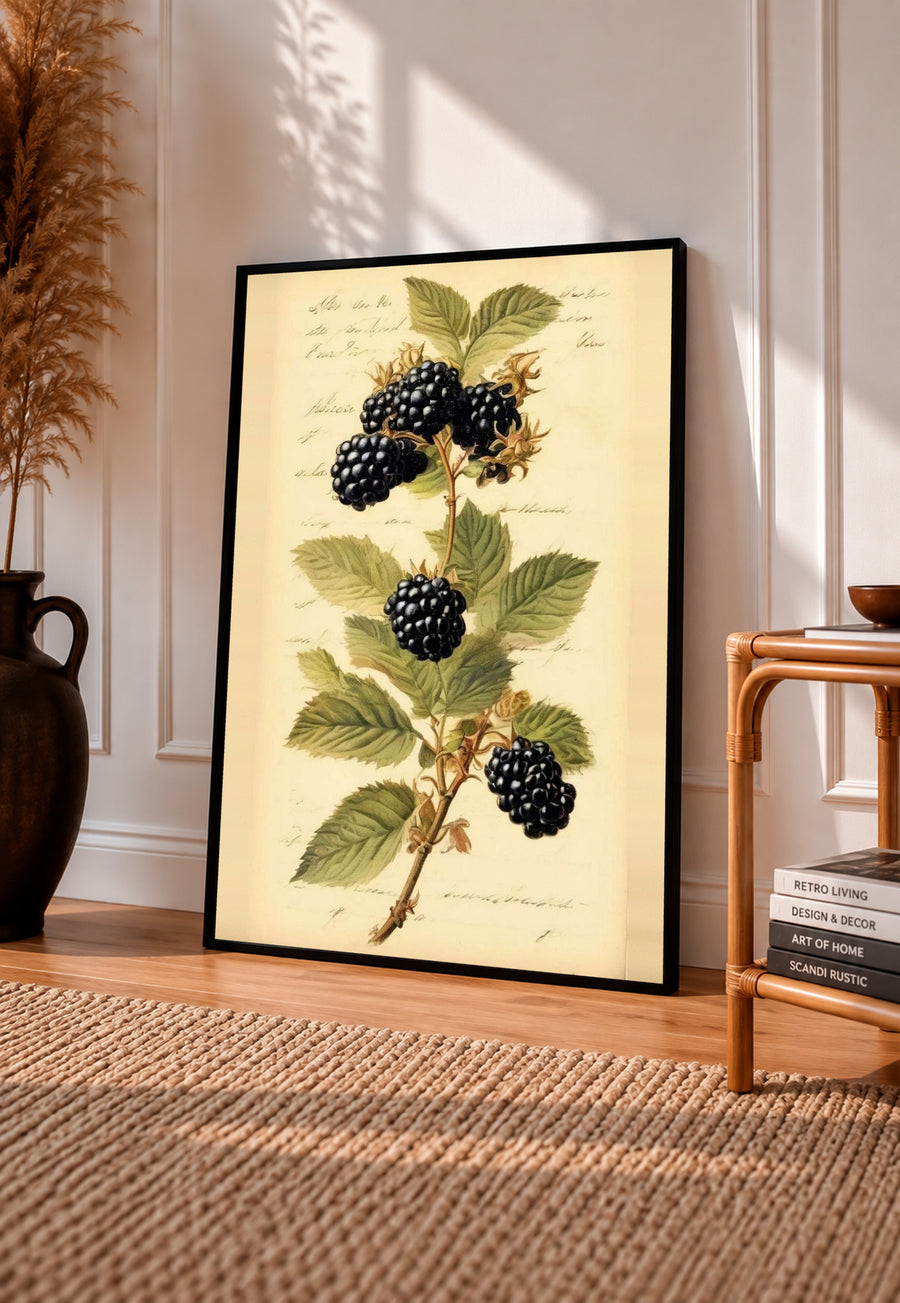 Black-framed botanical art print of blackberry branch with green leaves and dark berries