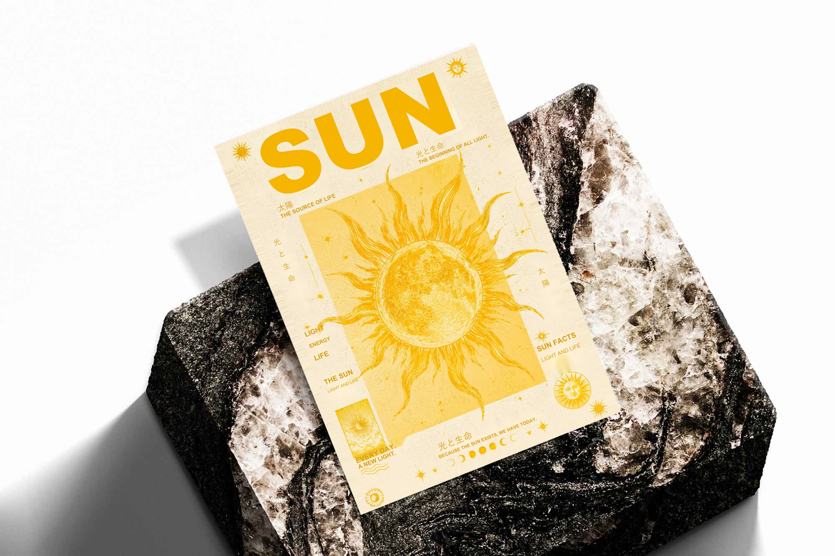 Sun typography and solar illustration as an unframed print propped against a pale wall on a rough stone