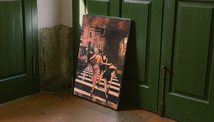 Framed street scene wall art with women in a pink dress walking along a striped crosswalk