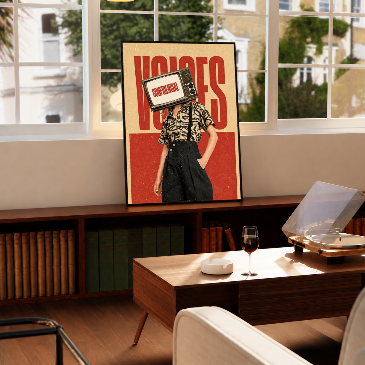 A television-headed figure in a patterned shirt before red Voices lettering in a black frame by a bright window above a record player