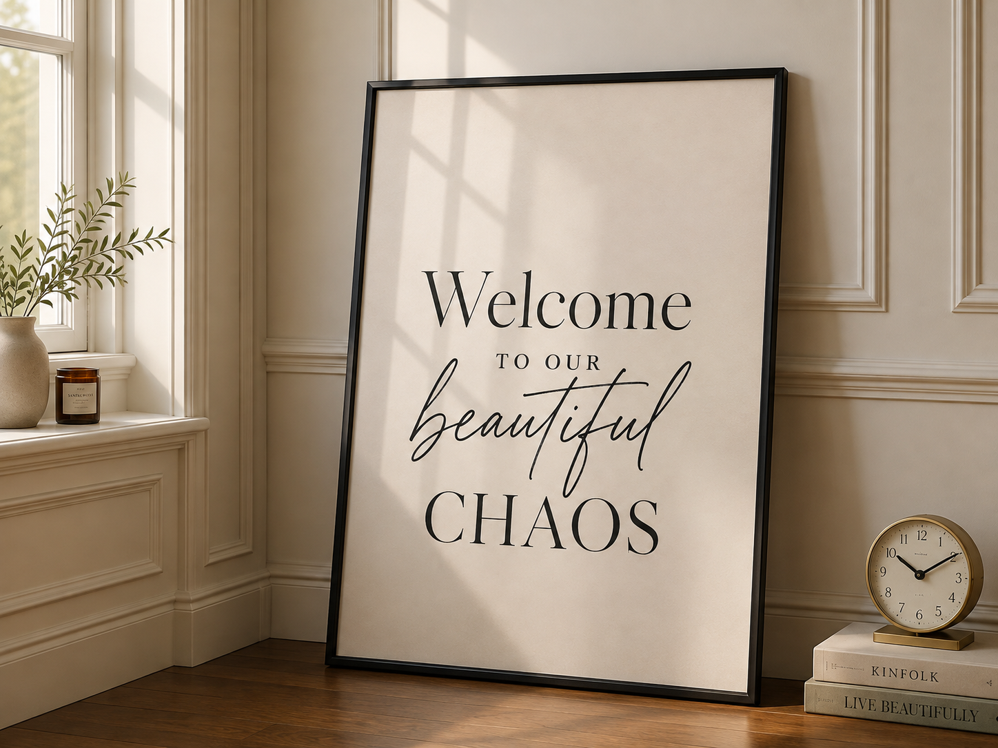 Portrait framed wall art reading 'Welcome to our beautiful CHAOS' in black frame