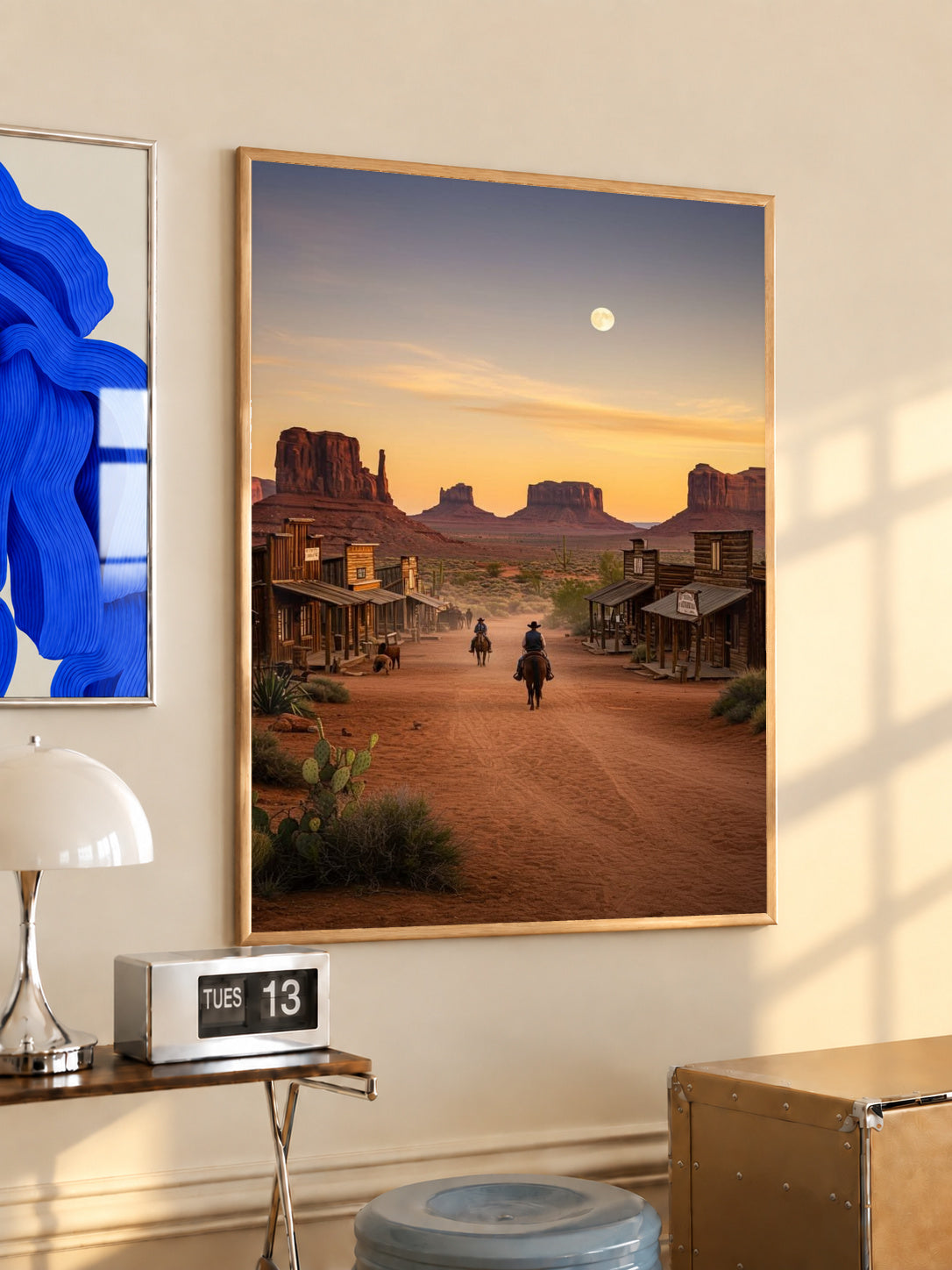 Framed western town sunset poster with street, cacti, and riders under a pale moon