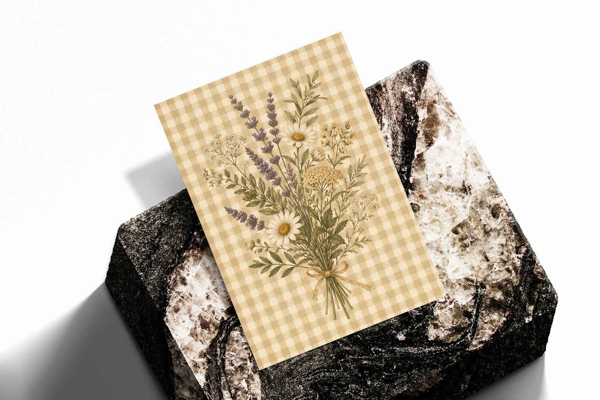 Tied bouquet of daisies lavender toned sprigs and white wildflowers on beige gingham as an unframed print standing on a stone plinth against white