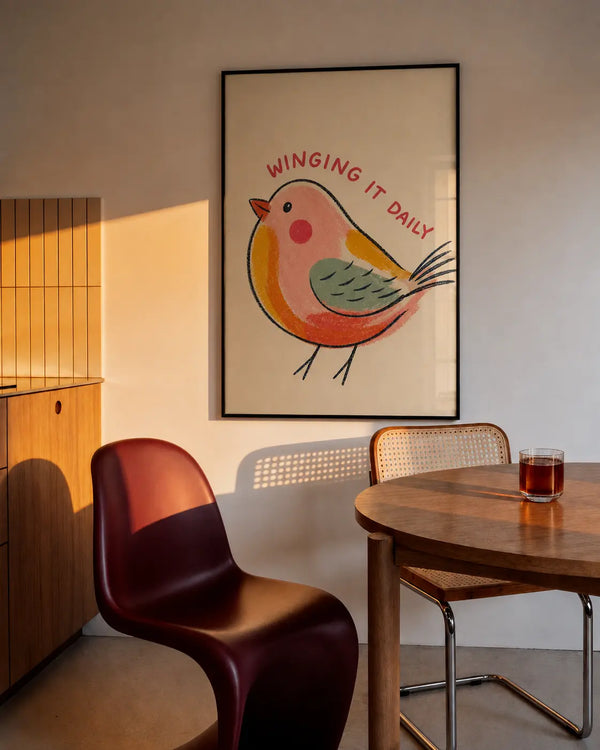 Framed bird wall art with cartoon songbird, red and green body, and arched red text