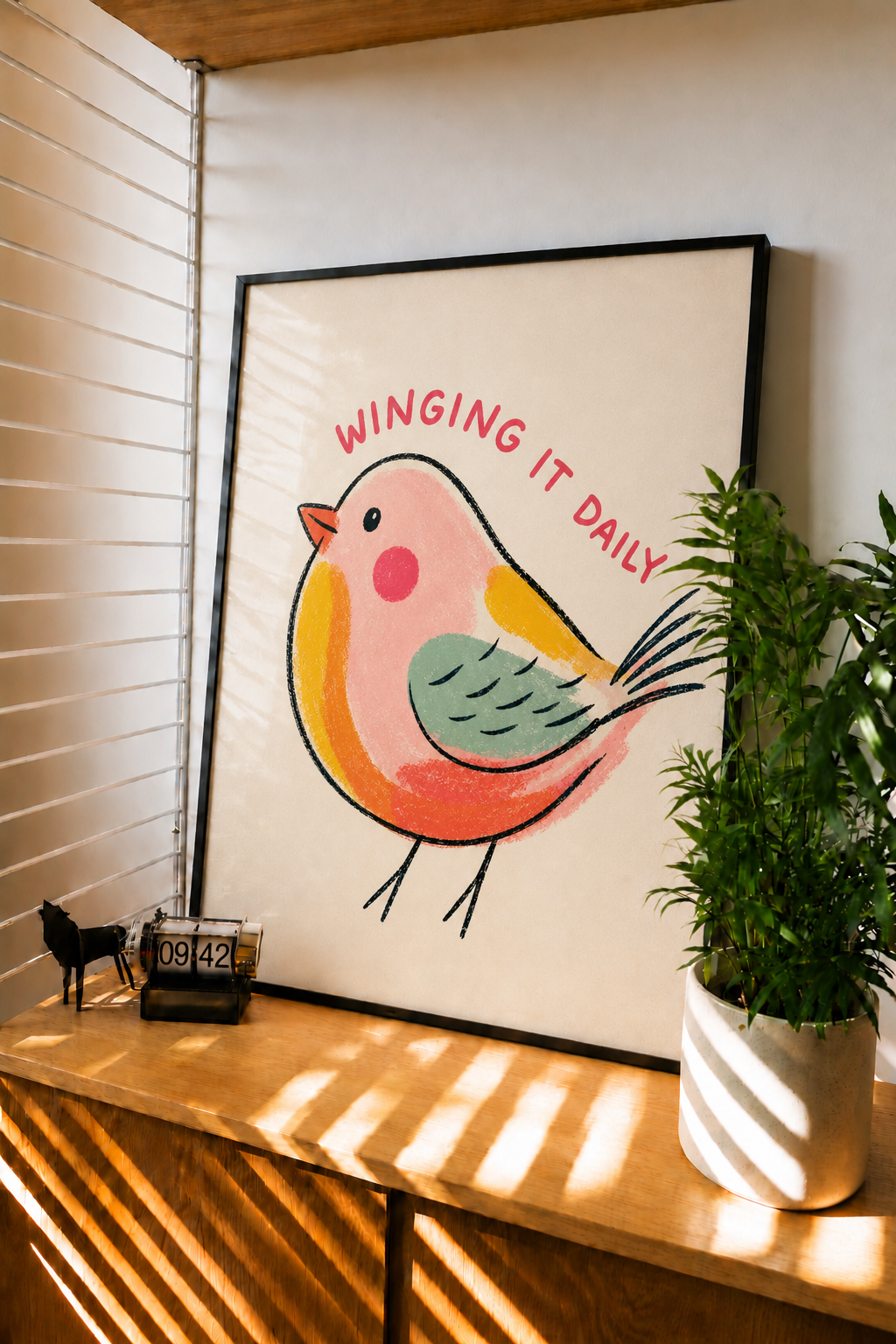 Framed bird wall art with cartoon songbird, red beak and green belly, and red headline text