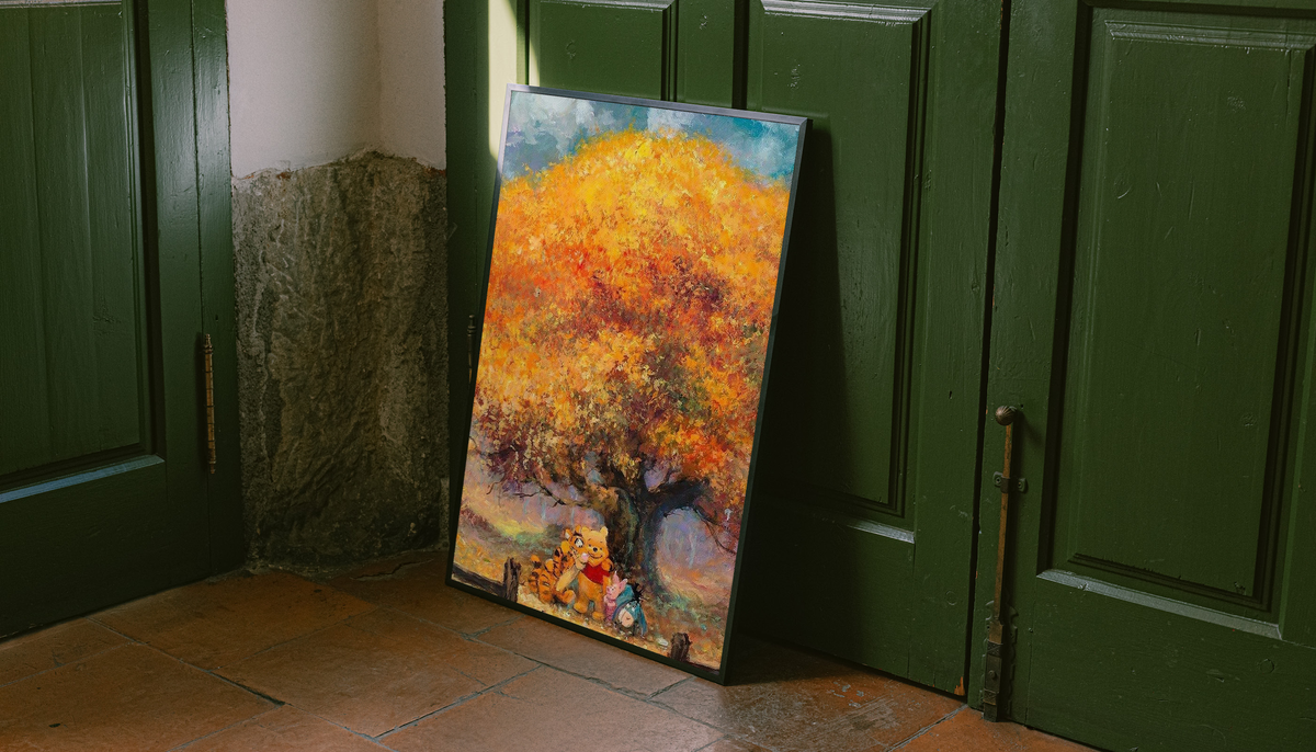 Autumn tree art print in a room, vertical frame with golden leaves and Pooh & friends