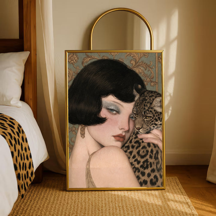 Gold-framed portrait art of a vintage pale woman holding a leopard on a rug