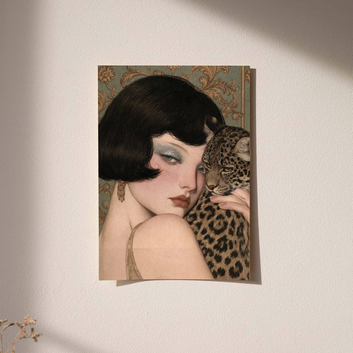 Framed portrait wall art with dark frame of a pale woman holding a leopard