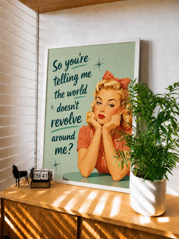 White-framed retro wall art print with blonde woman and quote on teal background