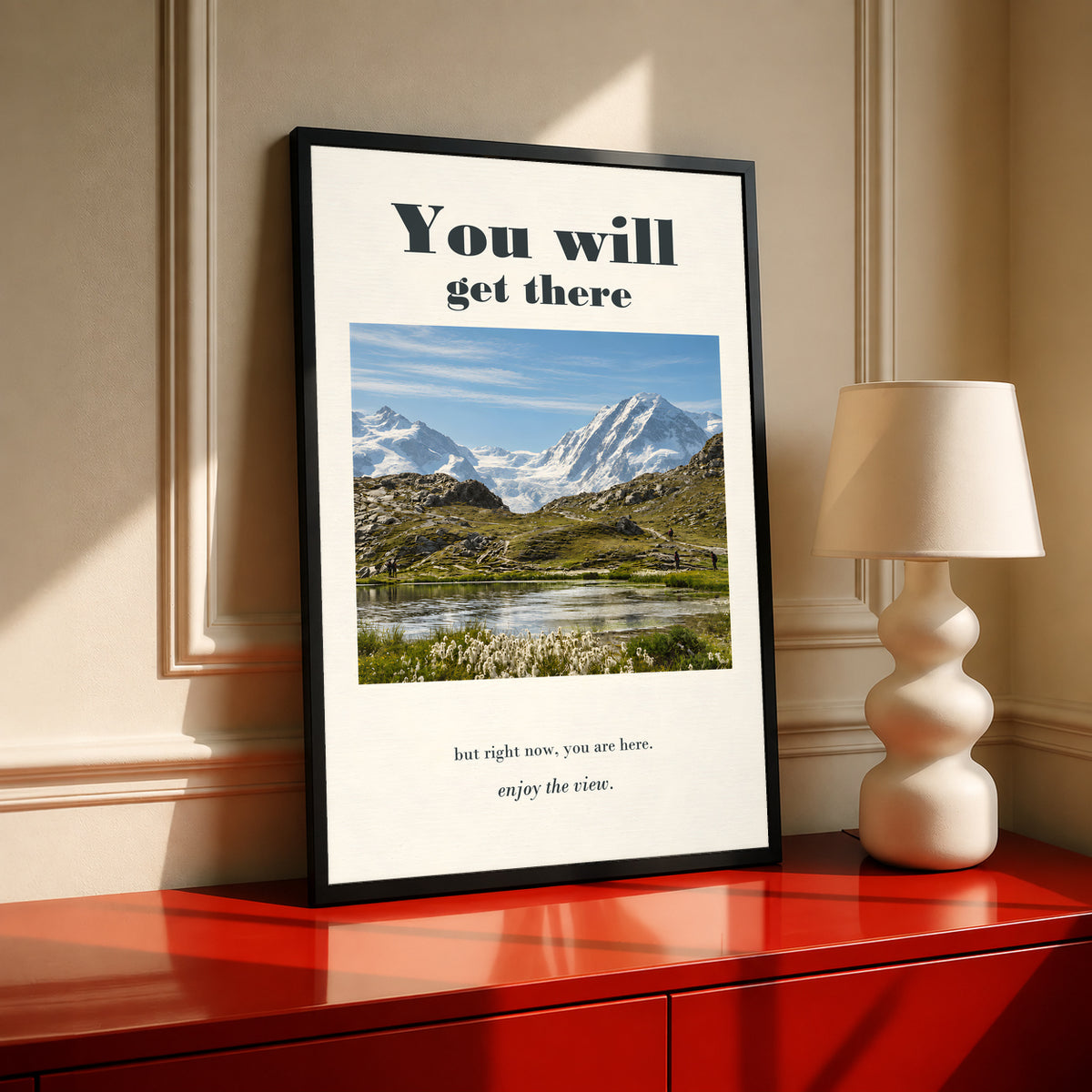 Mountain lake poster in a black frame with motivational text